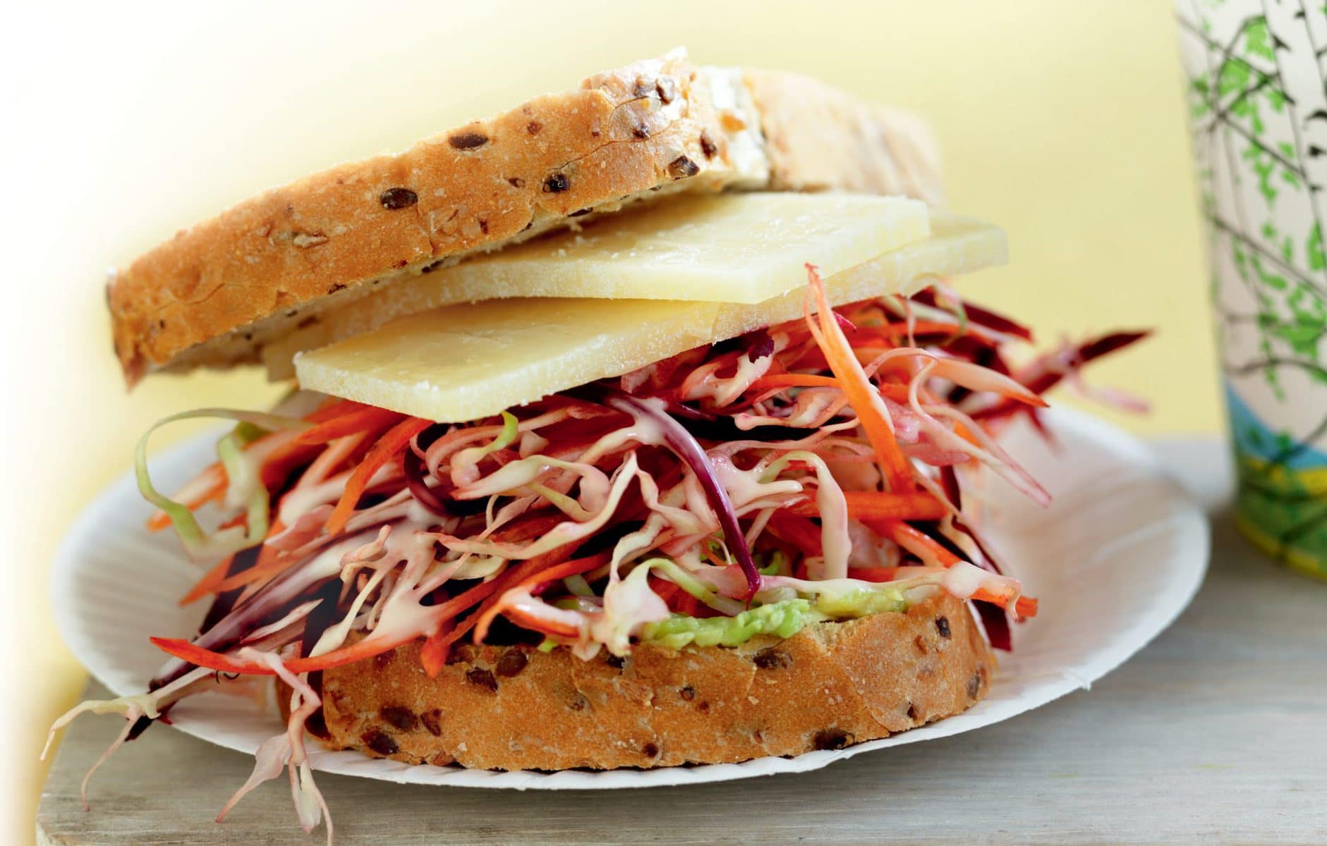 Avocado, shredded slaw and cheese sandwich