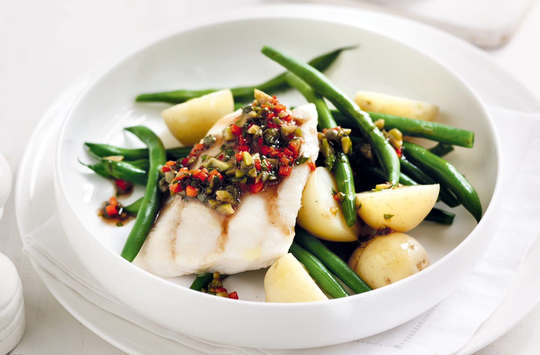 Baked fish with warm Niçoise dressing