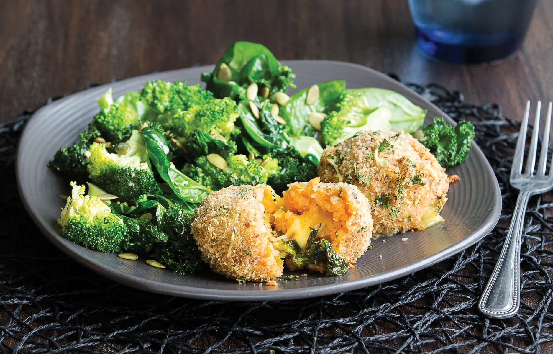 Cheesy risotto balls with warm winter salad