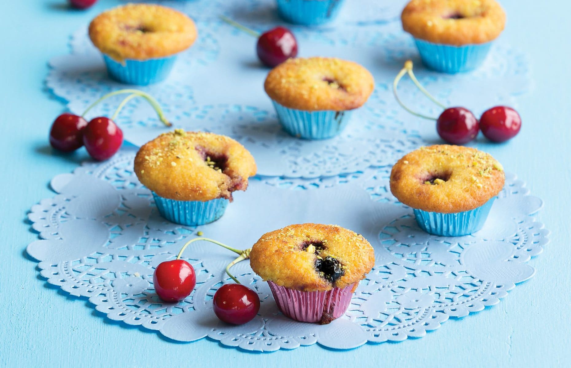 Cherry almond fairy cakes with pistachio dust
