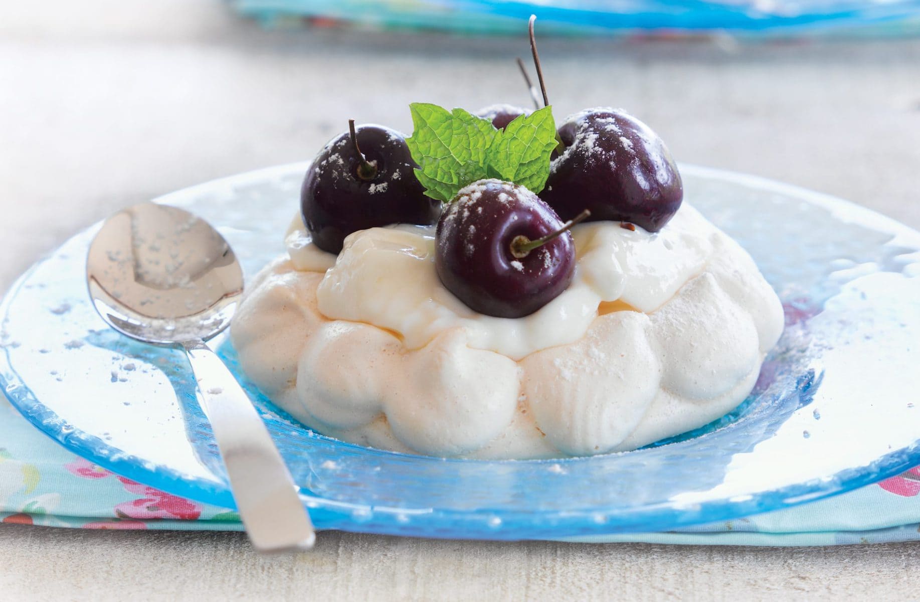 Cherry-topped meringue nests