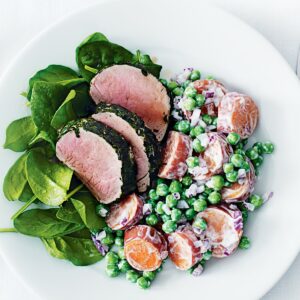 Herb-crusted pork with kumara and pea salad