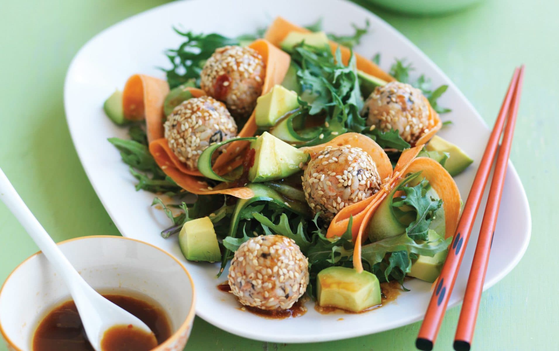 Japanese sushi balls with kale and avocado salad