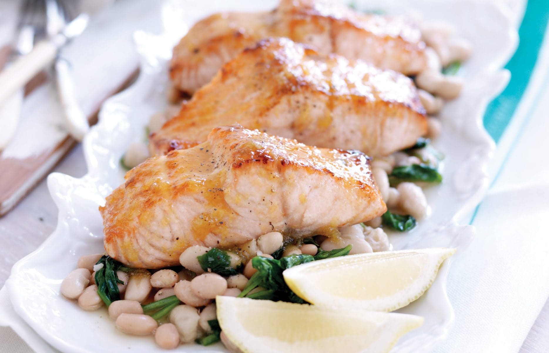 Maple-glazed salmon with spinach and white beans