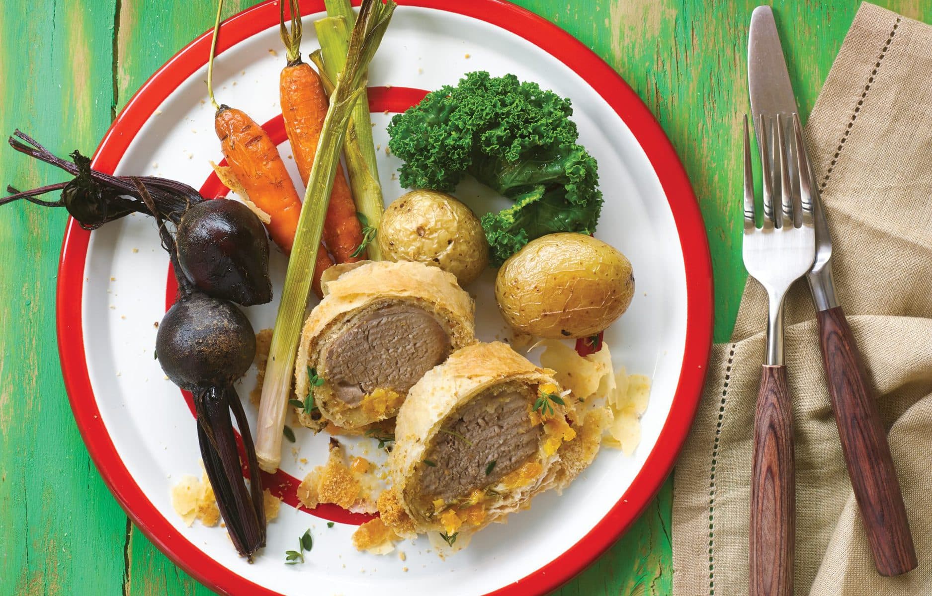 Pork, apricot and thyme strudel with baby vegetables
