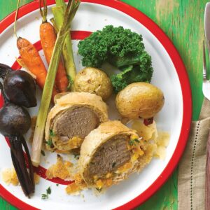 Pork, apricot and thyme strudel with baby vegetables