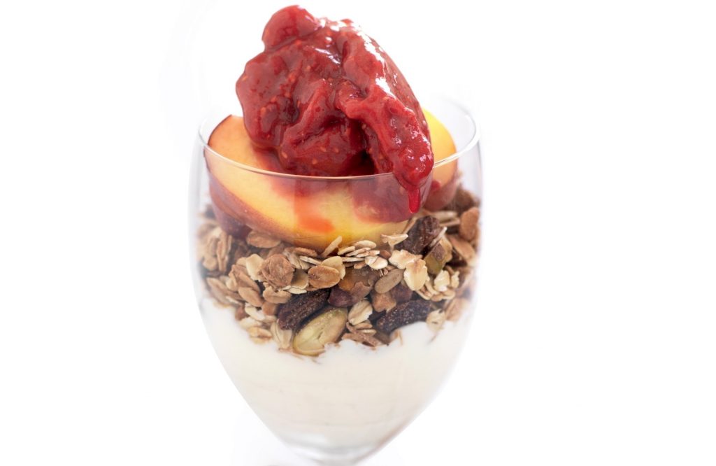 Raspberry and peach breakfast parfait