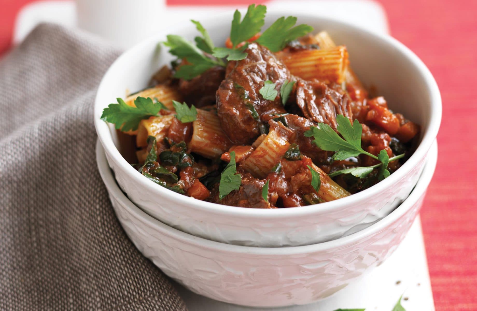 Rigatoni with slow-cooked beef ragu and silver beet