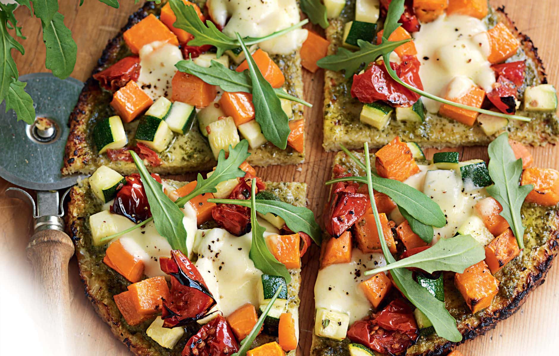 Roasted courgette, kumara, semi-dried tomato and rocket pizza