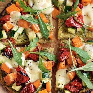 Roasted courgette, kumara, semi-dried tomato and rocket pizza