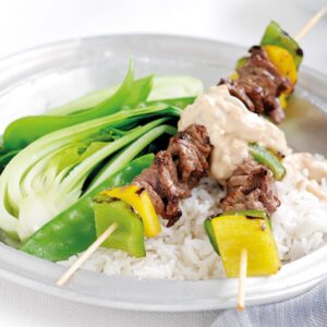 Satay beef skewers with Asian greens