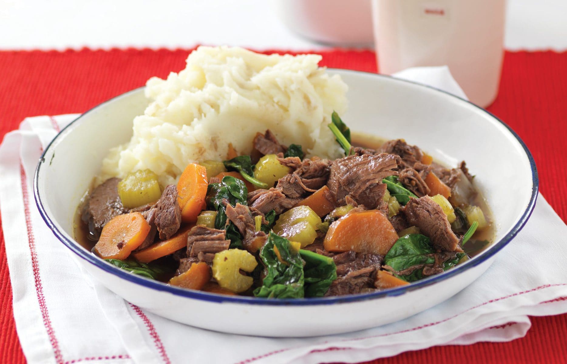 Slow-cooked beef with red wine and onions