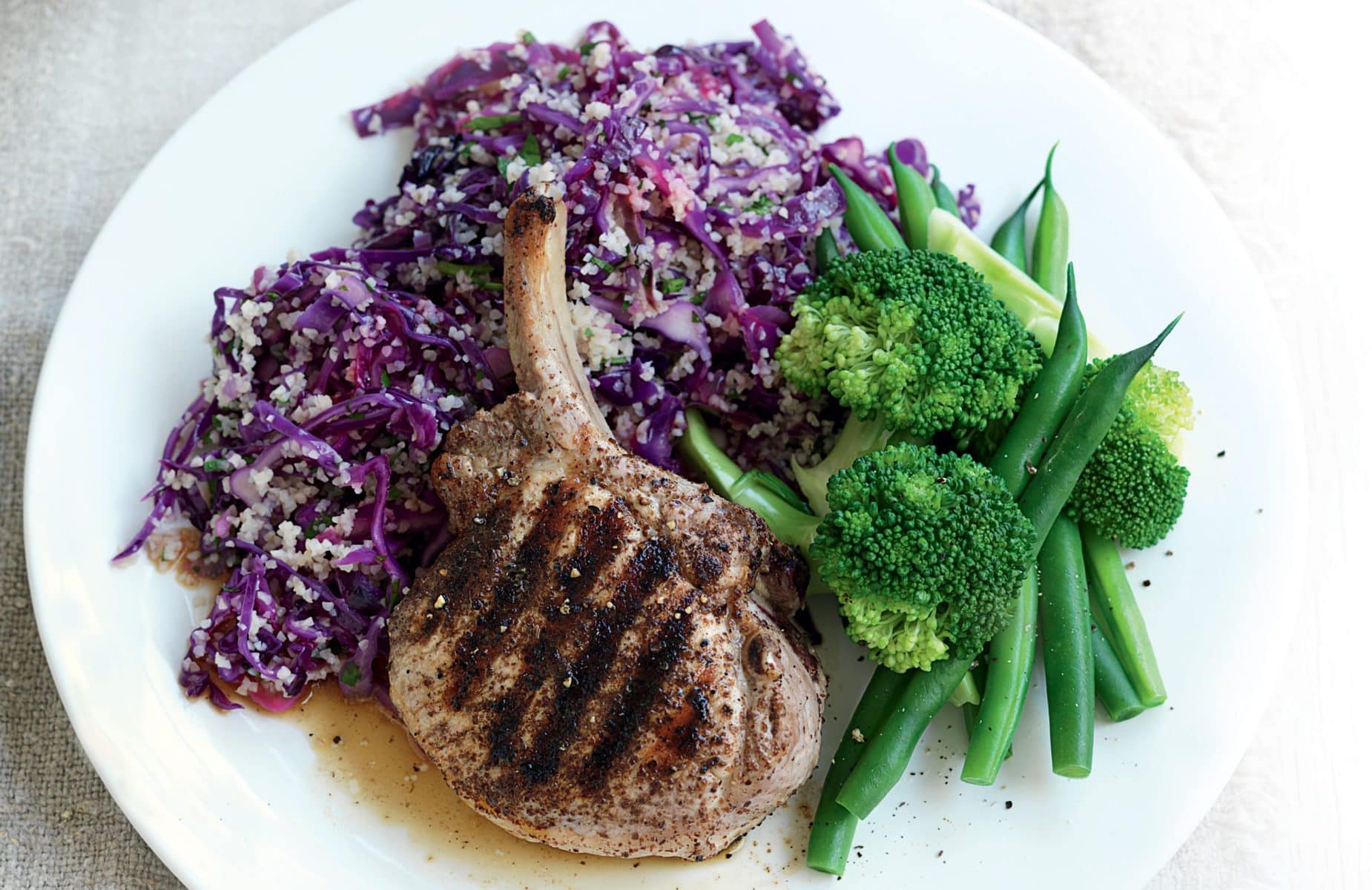 Spiced pork with red cabbage, bulgar and parsley salad