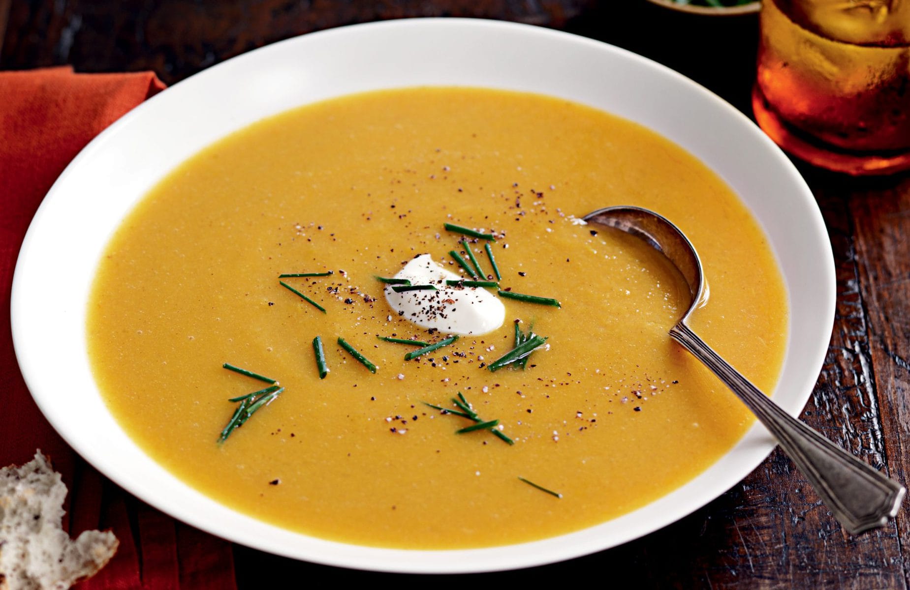 Spiced pumpkin soup with sour cream and chives