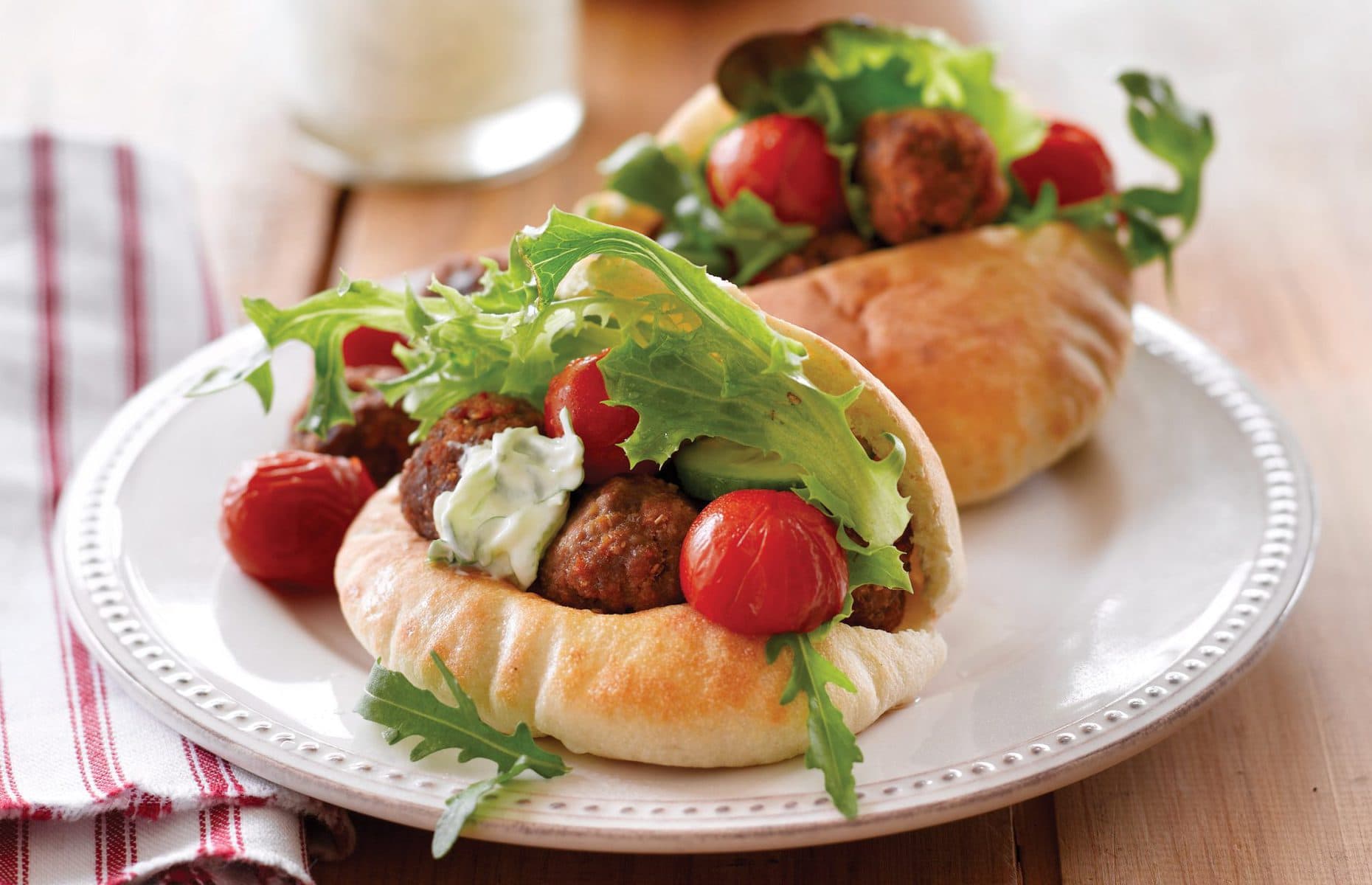 Spicy meatballs with roasted tomatoes and tzatziki