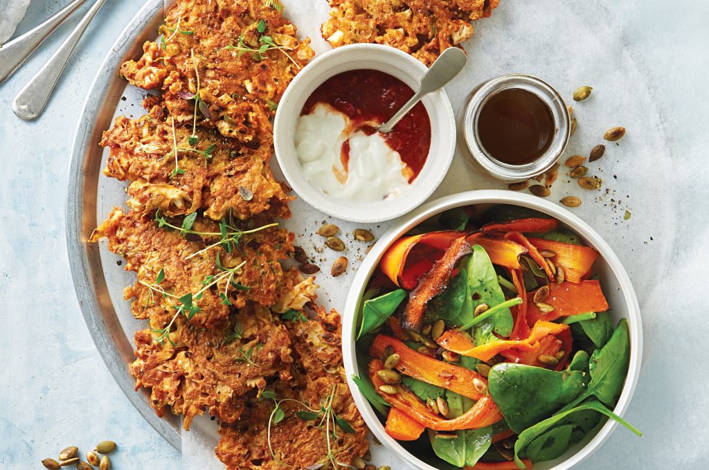 Cauliflower and potato fritters with winter spinach and roasted carrot salad Cauliflower and potato fritters with winter spinach and roasted carrot salad