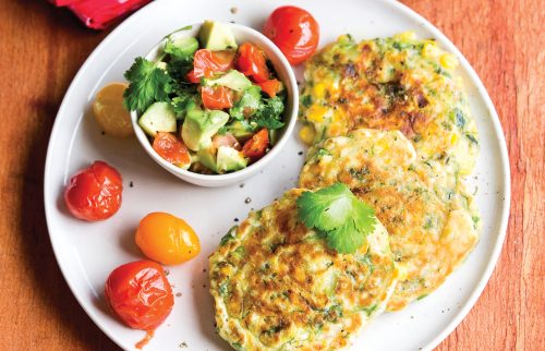 Corn fritters with chargrilled cherry tomatoes and avocado salsa