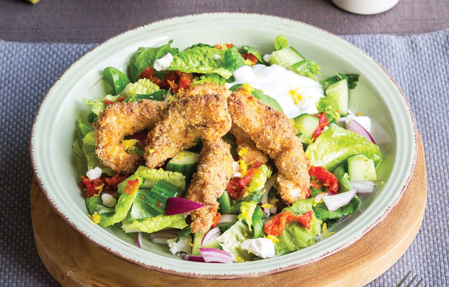 Crispy fish bites with salad and lemony dressing