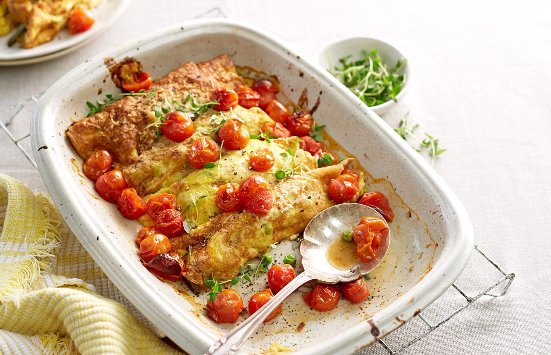 Egg cannelloni with creamy spring veges and roast tomato sauce