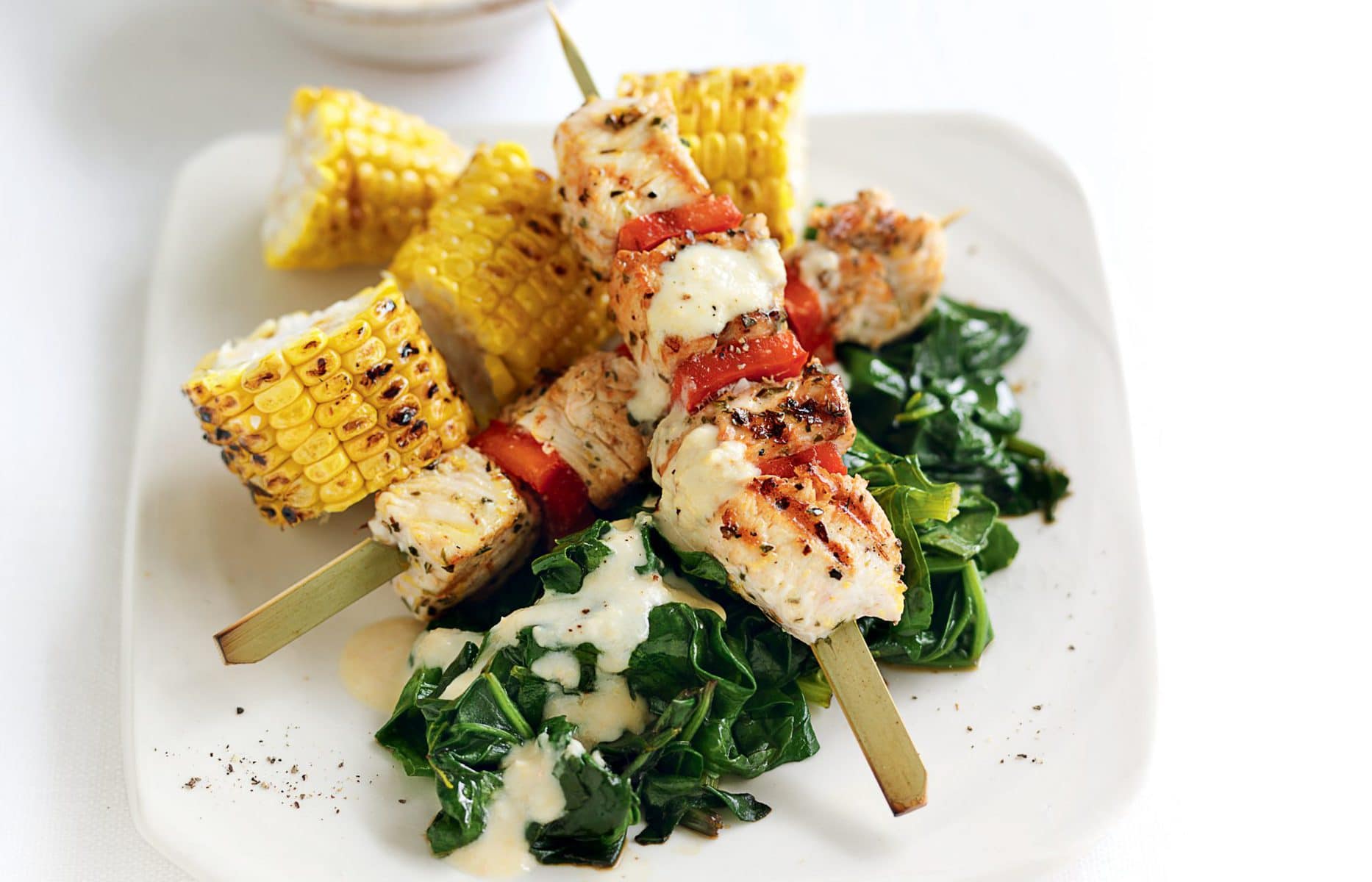 Grilled chicken skewers with hummus yoghurt