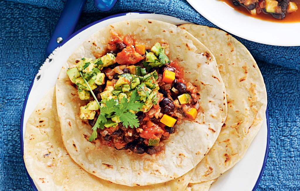 Mexican black beans with spicy avocado and grilled tortilla
