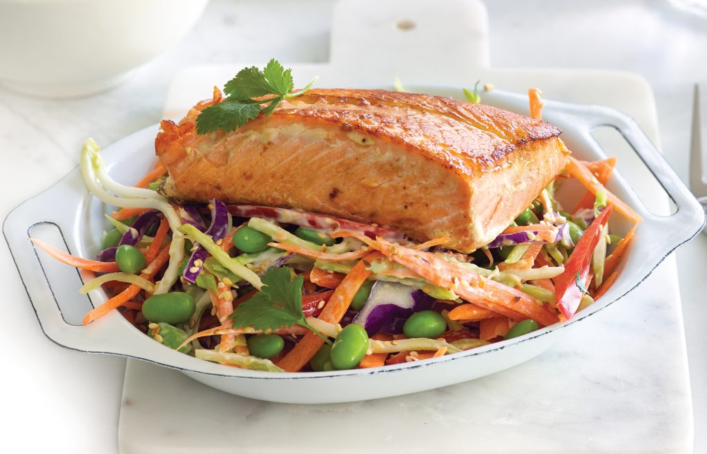 Salmon and Asian sesame slaw with brown rice and quinoa salmon on a plate