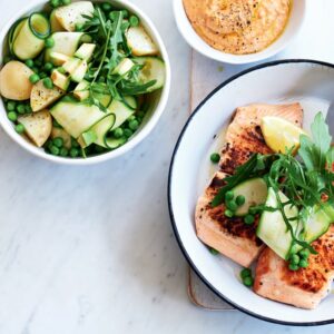 Salmon with spring salad and pumpkin hummus
