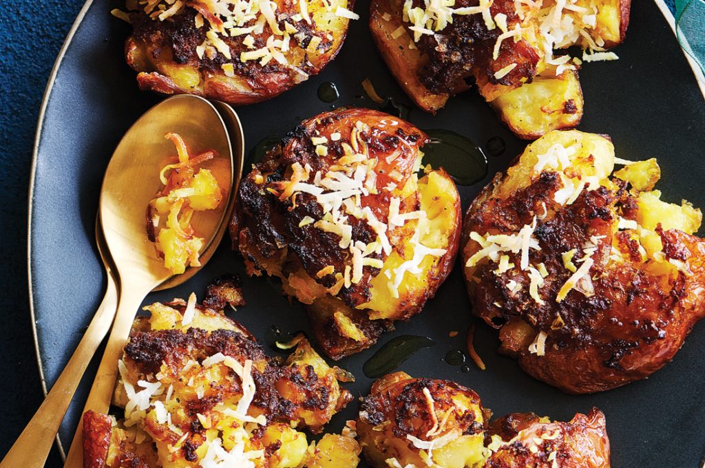 Smashed crispy roast potatoes with turmeric and coconut