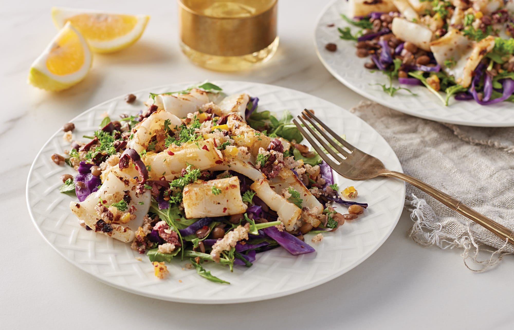 Squid with lentils and lemon-olive sprinkle