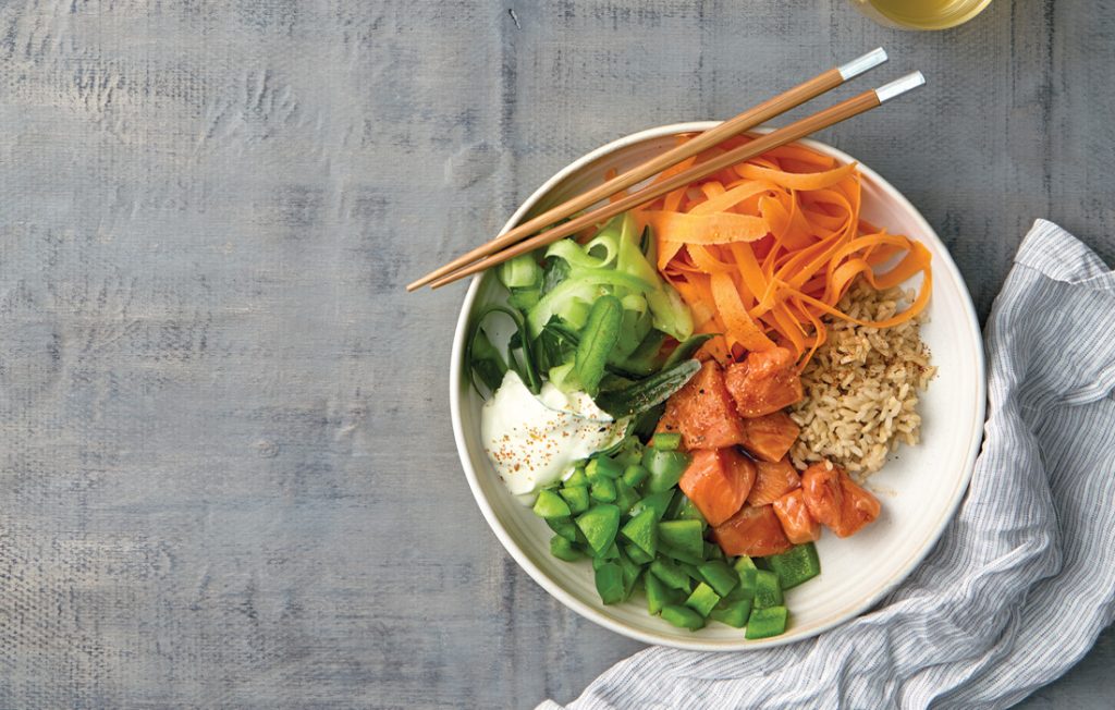 Sushi salad bowl with marinated salmon and wasabi mayo