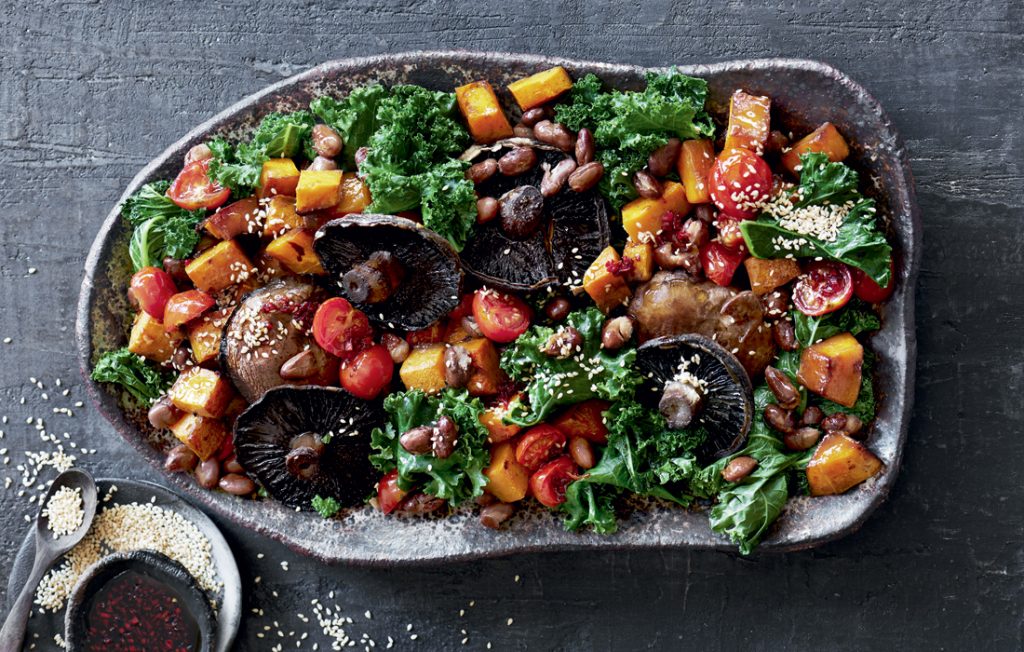 Warm roasted mushroom, kale and pumpkin salad with soy-chilli dressing