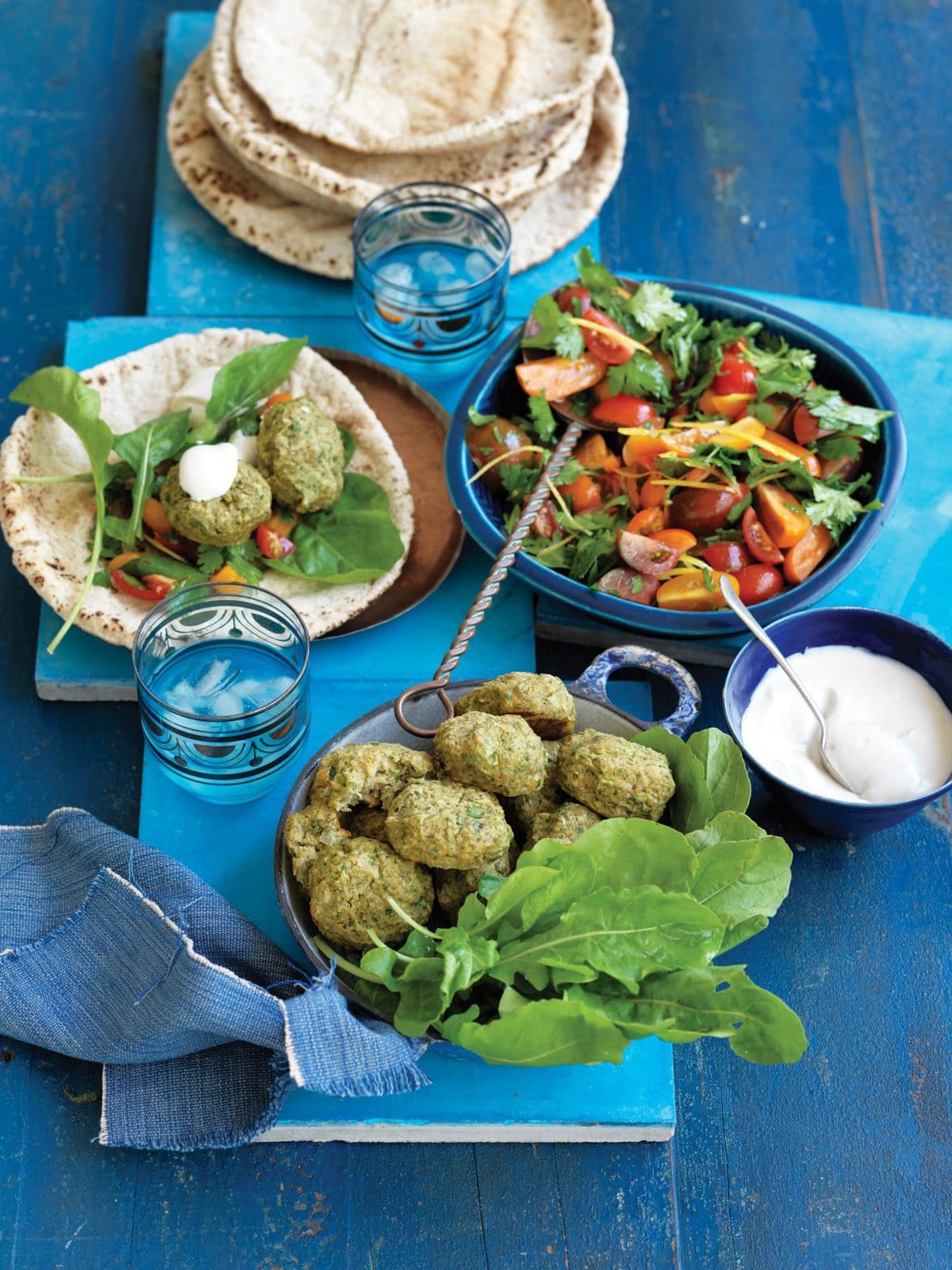 Baked falafels with tahini yoghurt and tomato salad