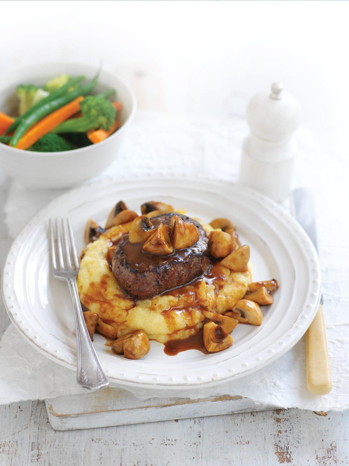 Beef and mushrooms on creamy polenta