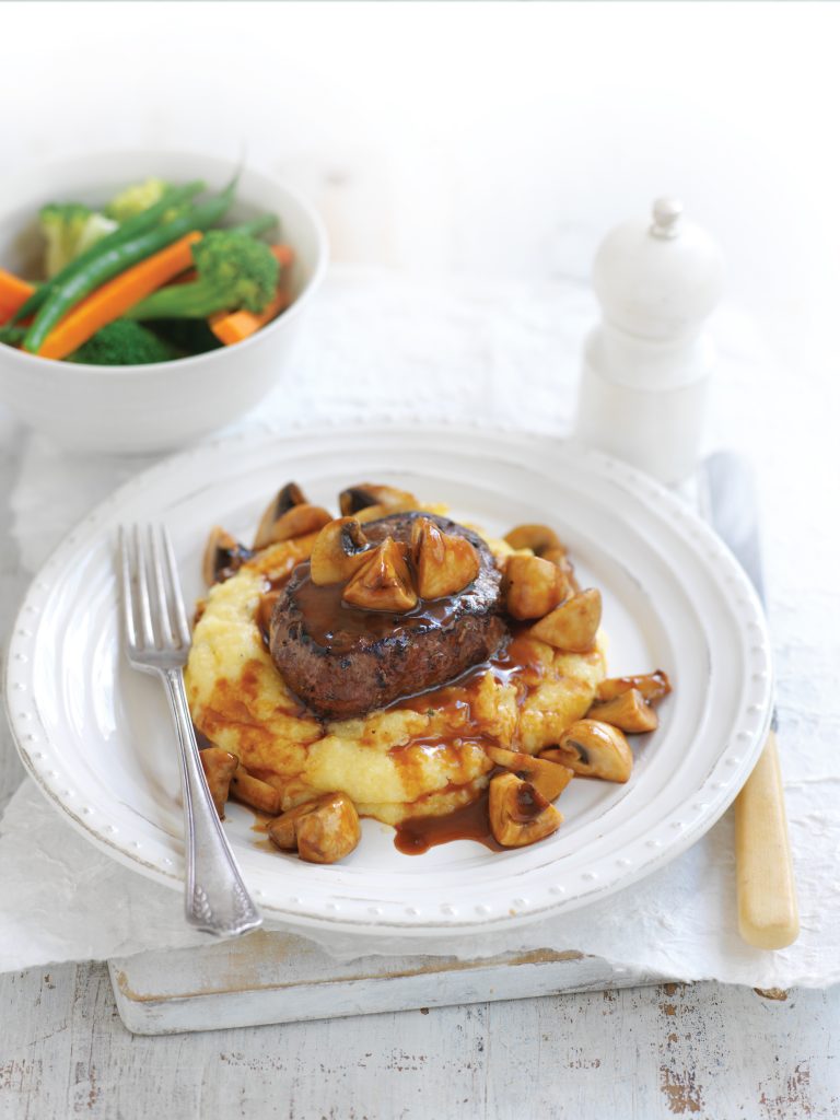 Beef and mushrooms on creamy polenta