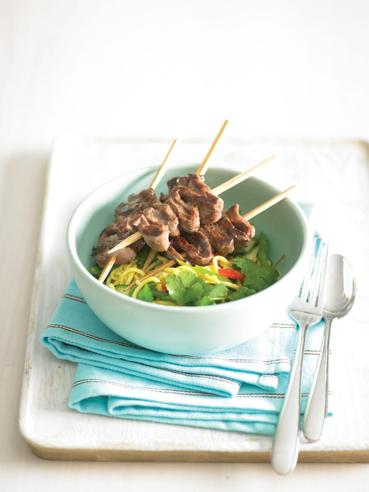 Beef kebabs with vegetable noodle salad