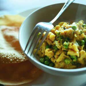 Cauliflower, pea and potato curry with poppadums