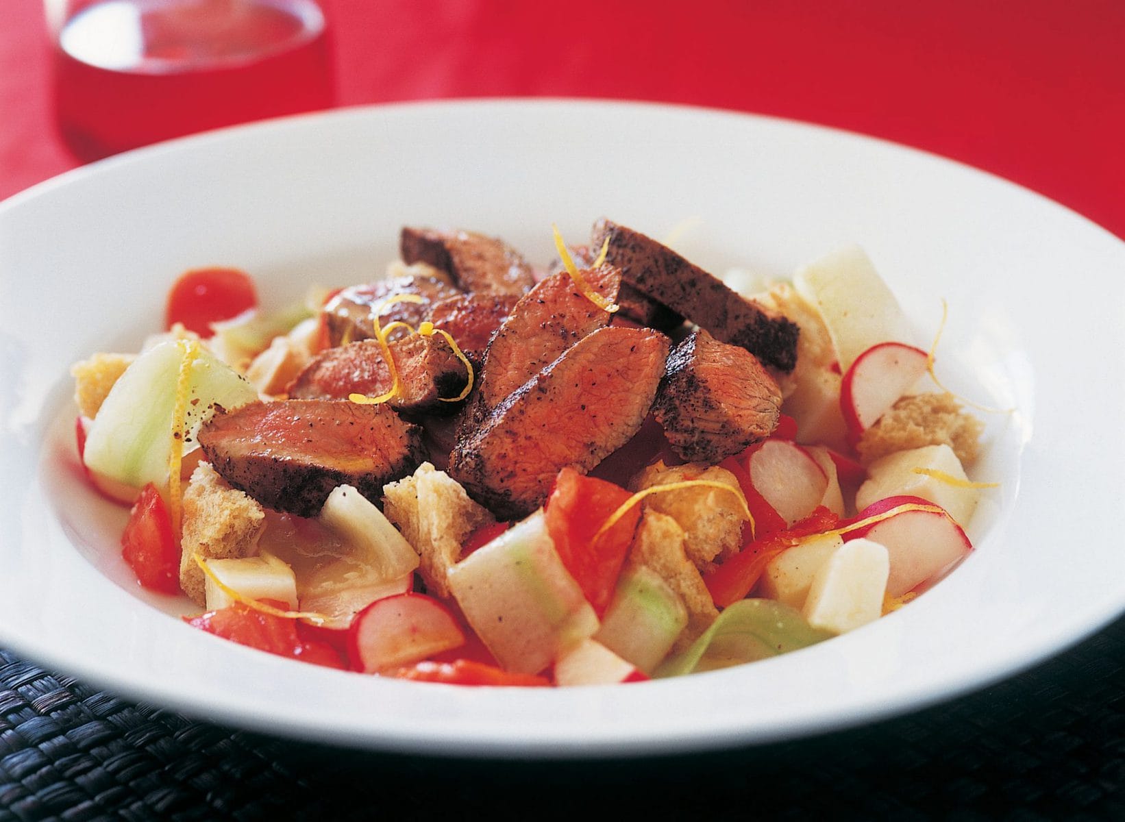 Cucumber, tomato and goats’ cheese salad with grilled lamb