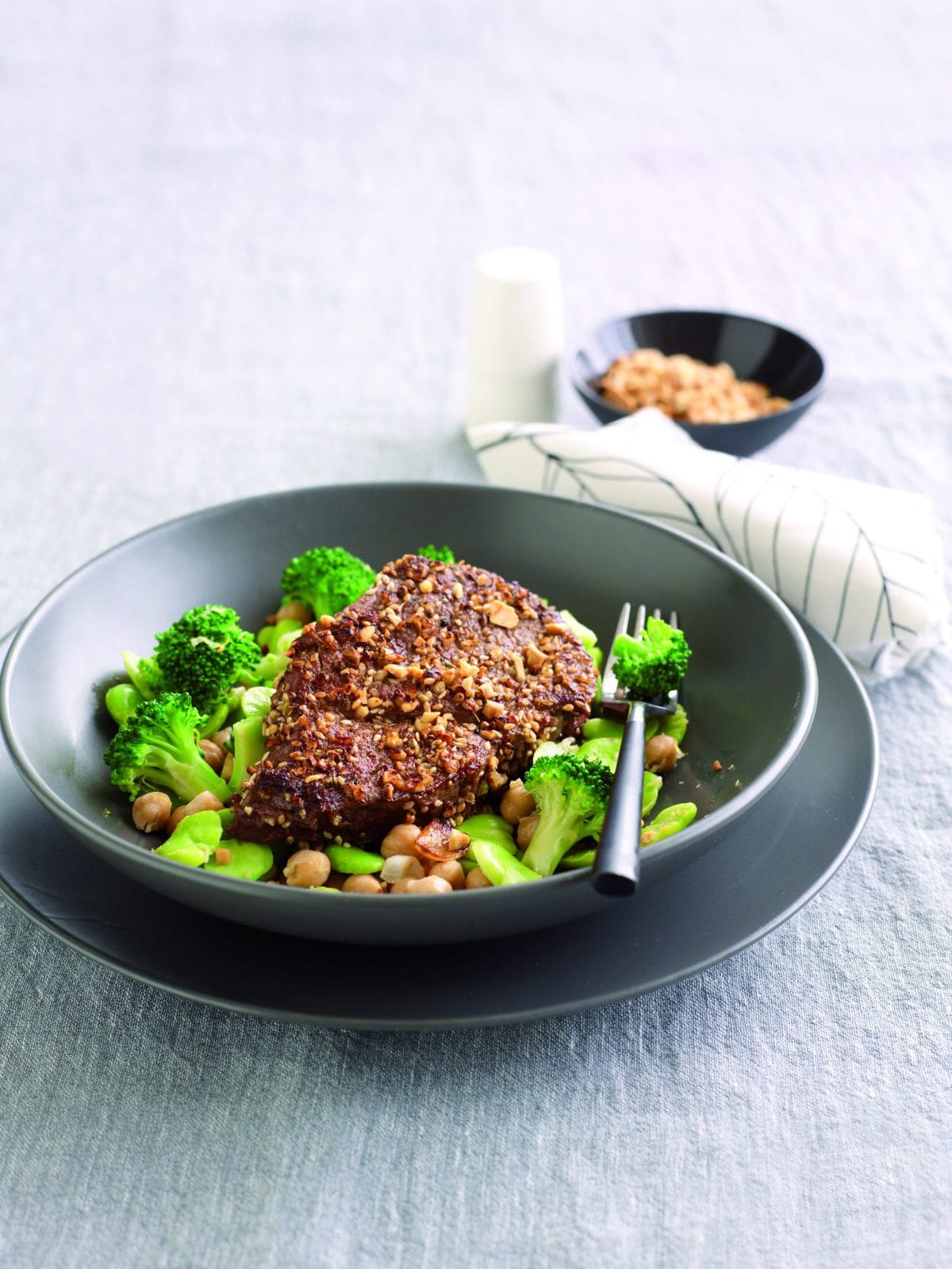 Dukkah-crusted steak with lemony broccoli and broad beans