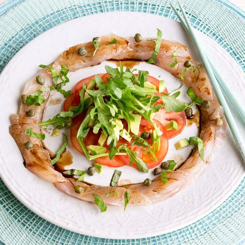 Fish carpaccio with avocado and tomato Fish carpaccio with avocado and tomato