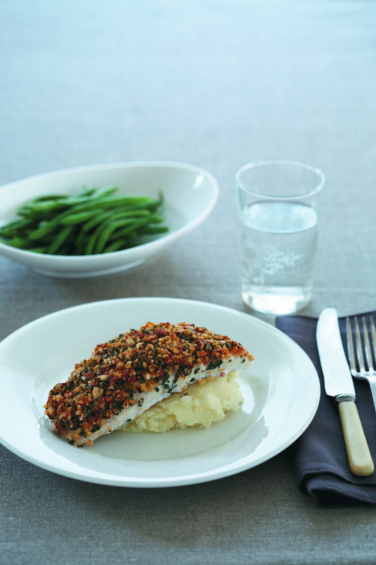 Fish with cashew and basil topping