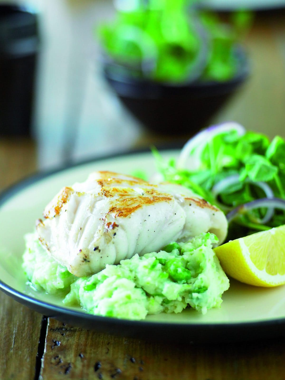 Fish with cheesy pea mash