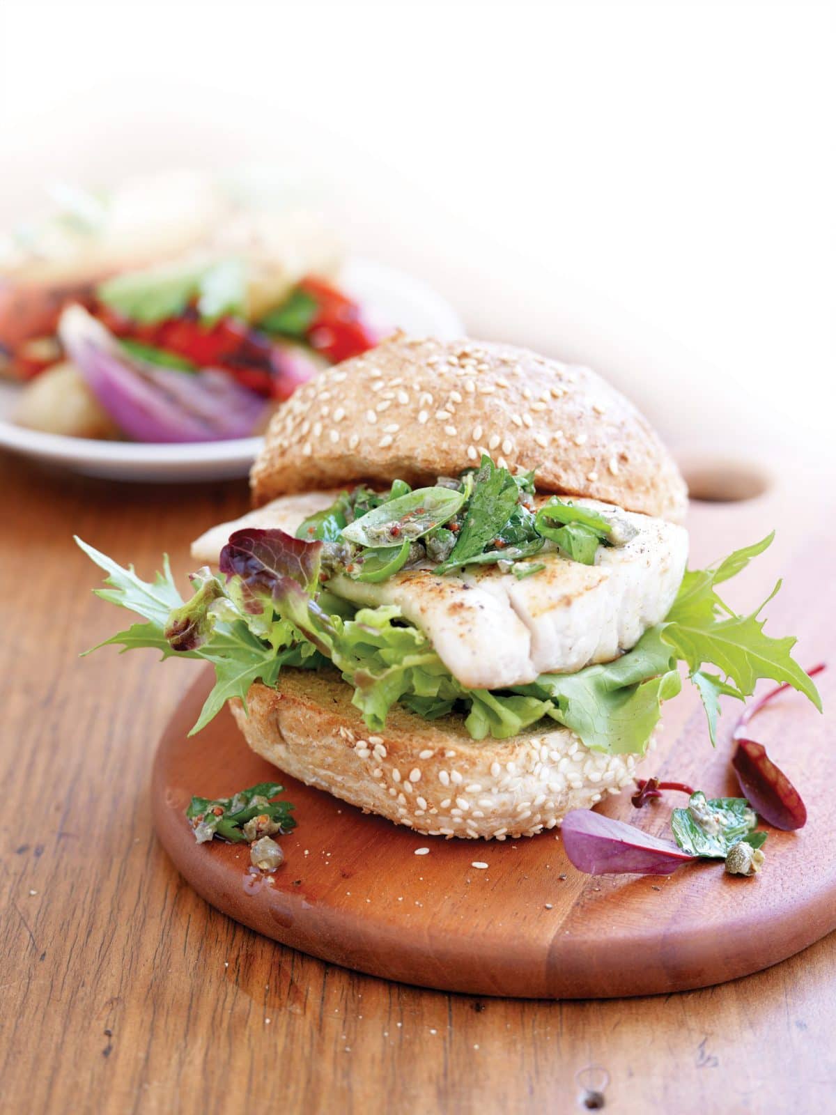 Grilled fish burgers with basil and caper salsa