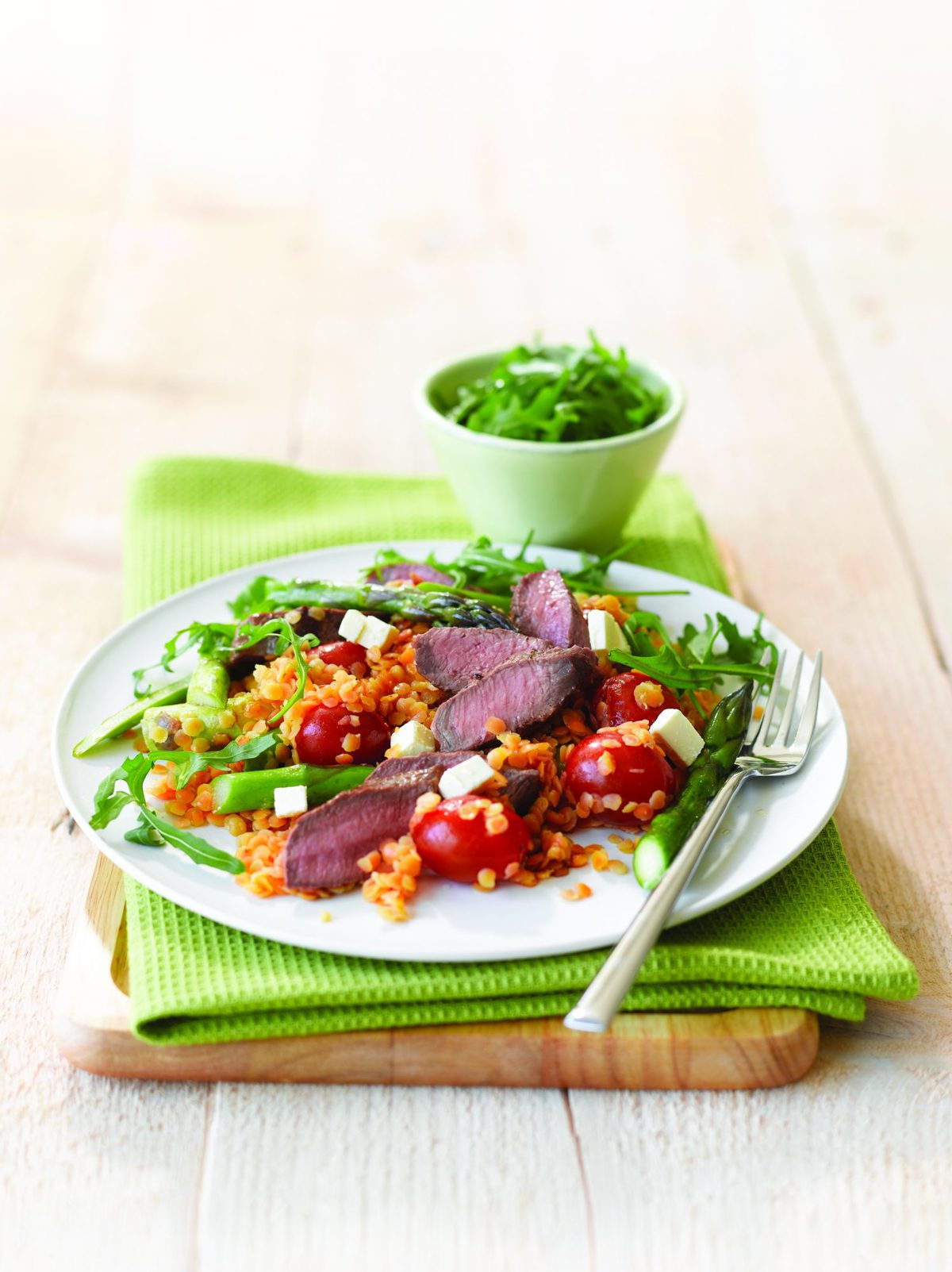 Lamb with warm lentil salad