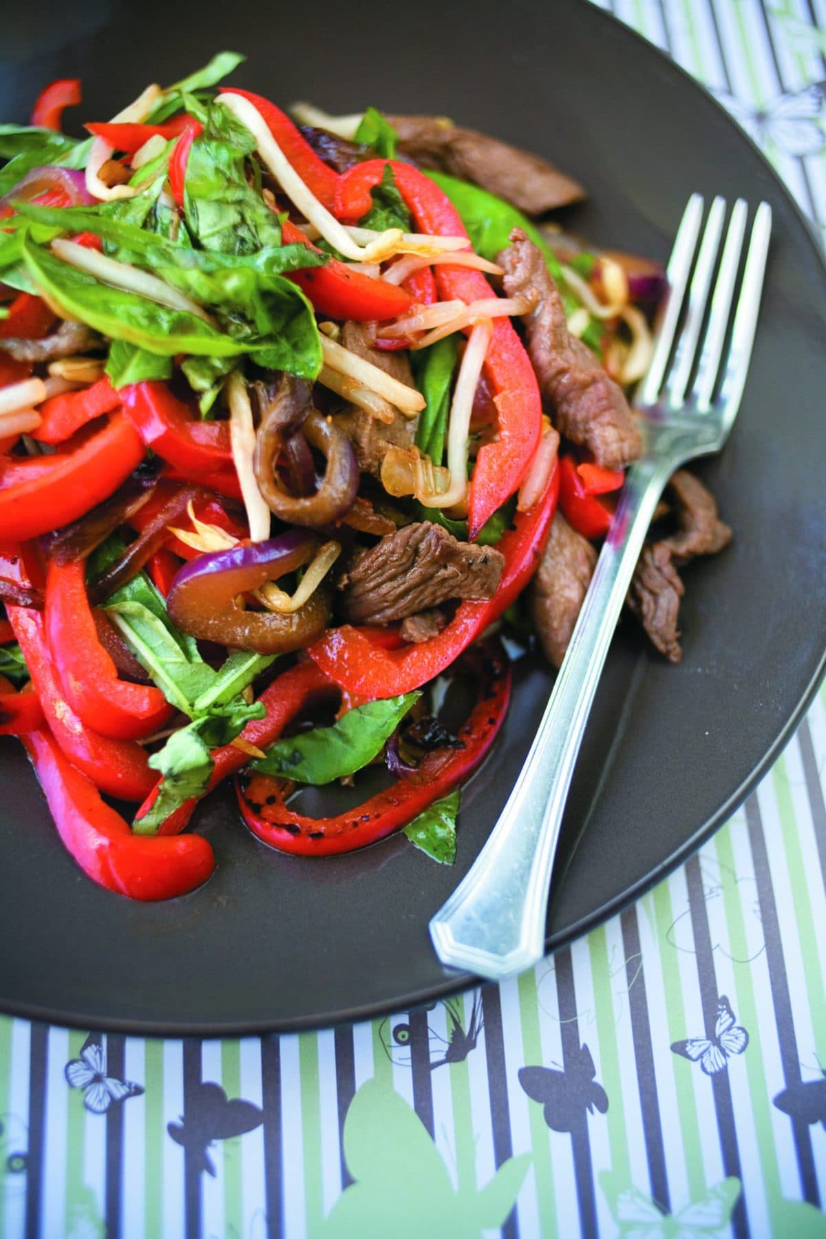 Marinated steak with bean sprouts and basil