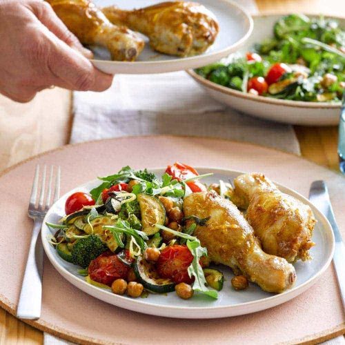 Mustard chicken with roasted chickpeas, tomatoes and garlicky greens