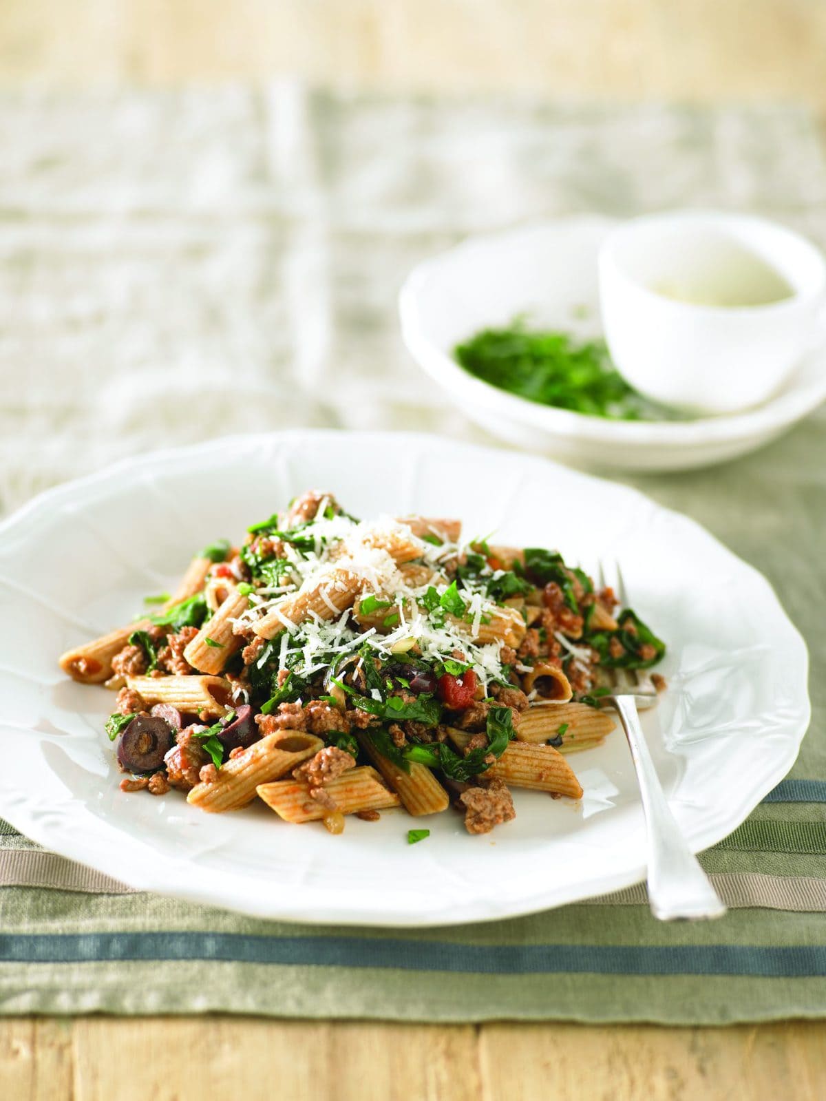 Penne with lamb, olives and spinach