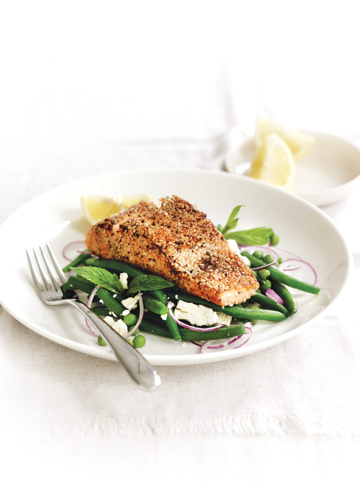 Pepper and sesame-crusted salmon with mint peas