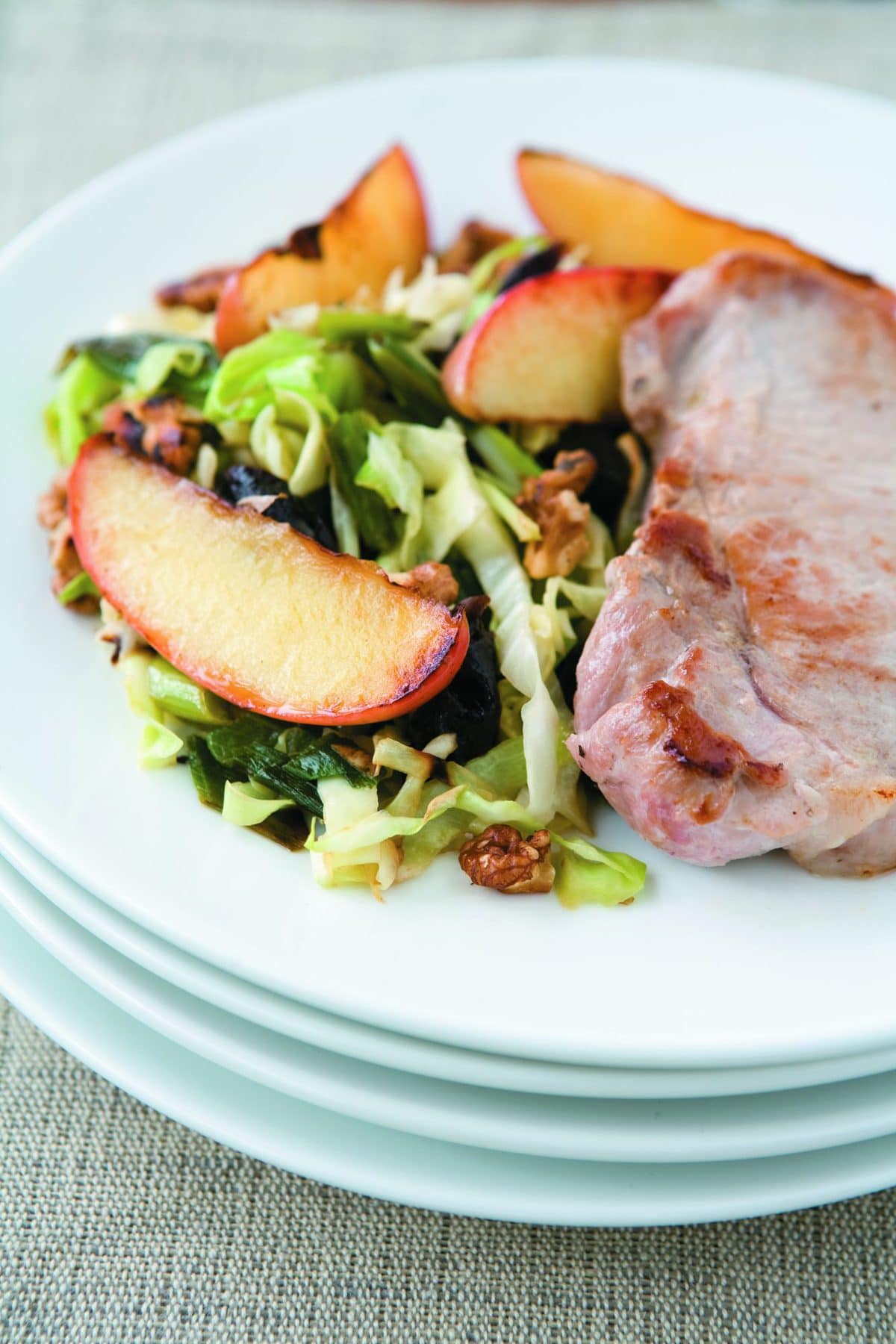 Pork steaks with apple and walnut slaw