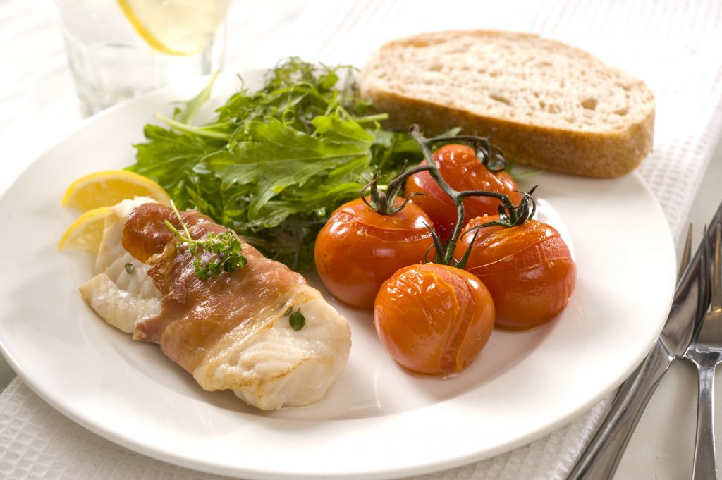 Prosciutto-wrapped fish with roasted vine tomatoes Prosciutto-wrapped fish with roasted vine tomatoes