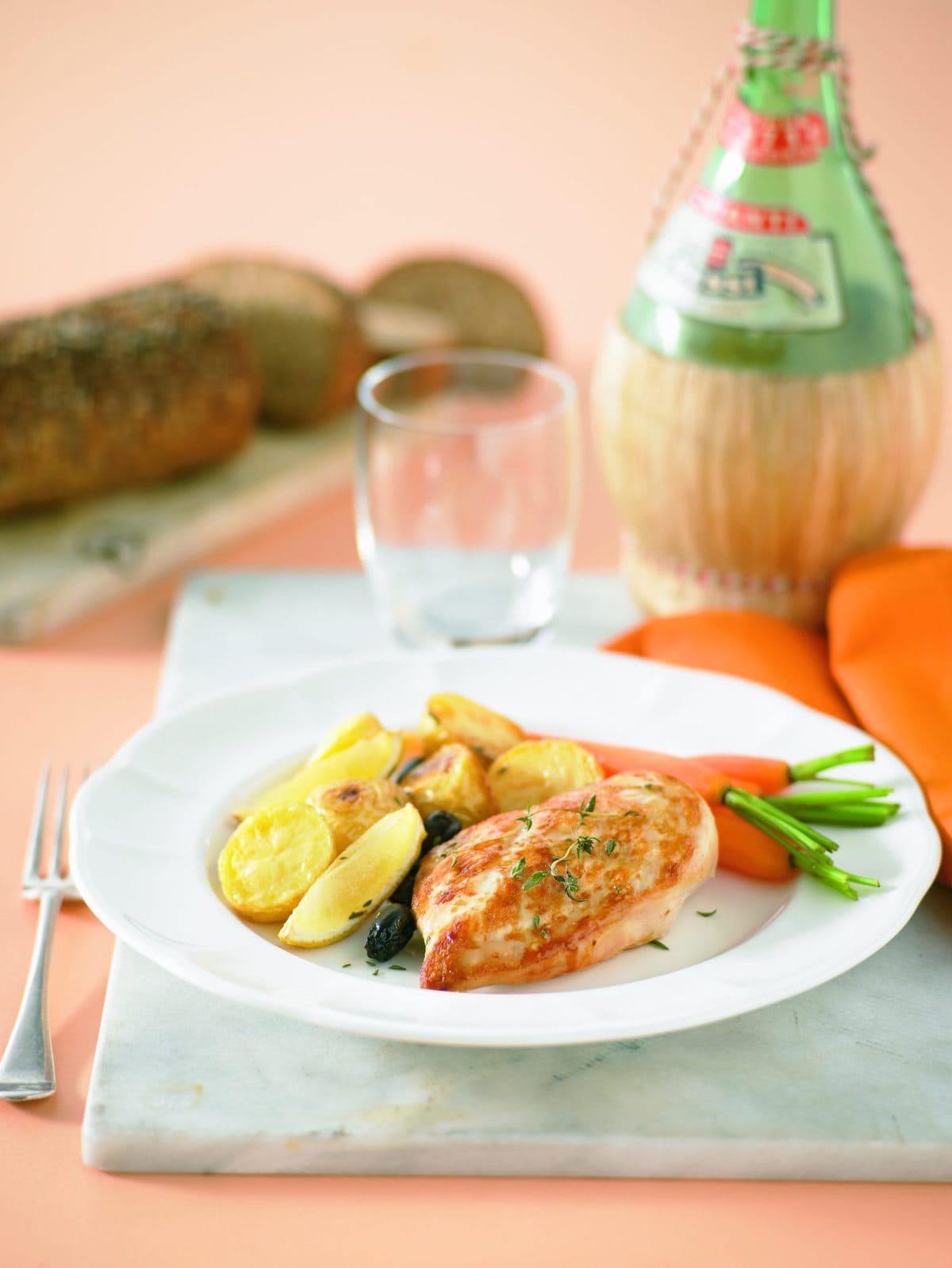 Roasted chicken breast fillets with lemon, olives and thyme